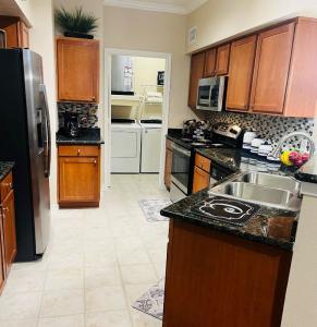 One Bedroom Apartments in Katy Texas - Model Kitchen with View to Laundry Room